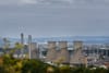 Article headline: FFS explains: why Grangemouth shut – and what happens next Image description: Cooling towers and chimneys o