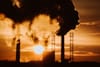 Article: 'Licence to pollute'? Prosecutions of environmental rule-breakers plummet Image description: pollution smoke at suns