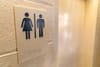 Headlineç Scots charity in trans rights row after announcing change to bathroom access Image description: Unisex Bathroom sig