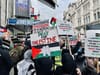 Article headline: Palestine Action: Why has the UK proscribed the group? Image description: People hold Palestinian flags and